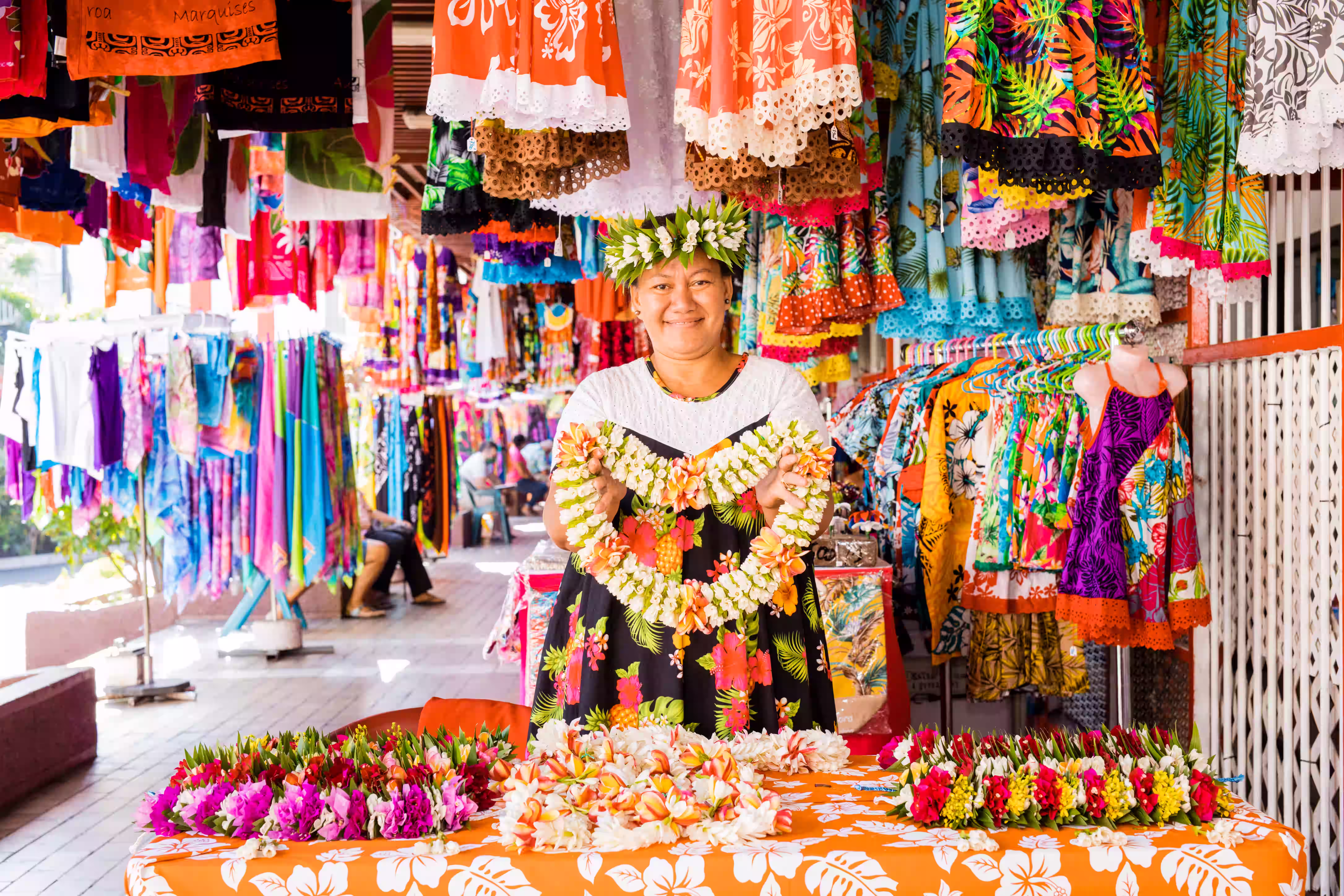 A woman standing at  Papeete market, Tahiti.